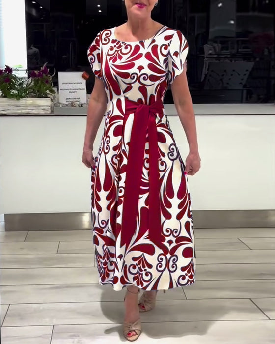 Elegante jurk met korte mouwen en contrastprint