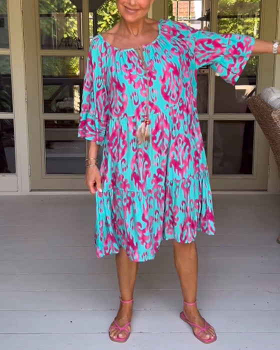 Jurk met losse print en klokmouwen