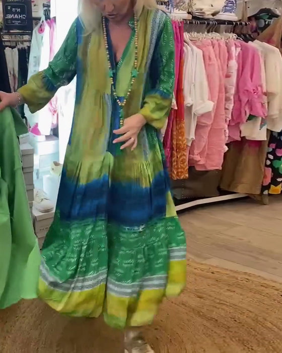 Casual lange jurk met V-hals, uitlopende mouwen en print