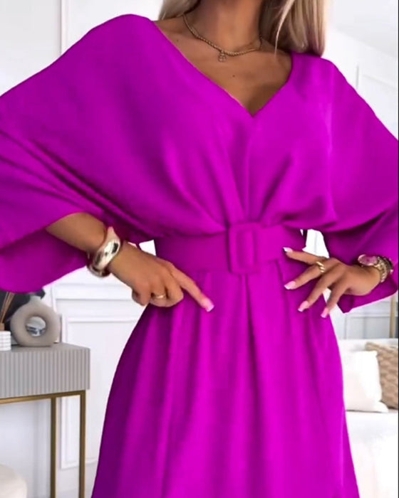 Elegante effen jurk met V-hals, split en lange mouwen