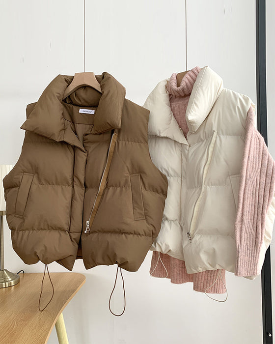 Eenvoudige effenkleurige, gewatteerde jas met ritszak en mouwloos design