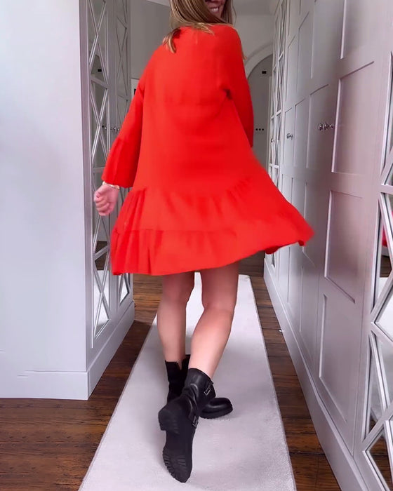 Effen kleur uitlopende patchworkjurk met lange mouwen en V-hals