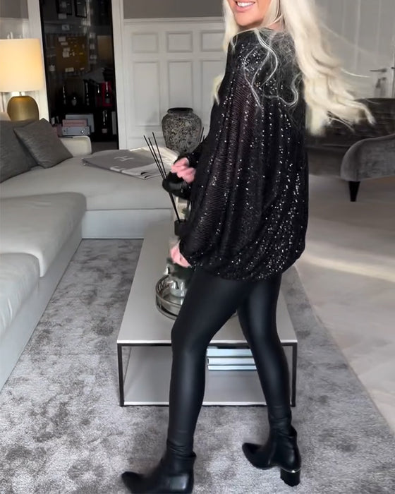 Top met ronde hals en ballonmouwen en pailletten