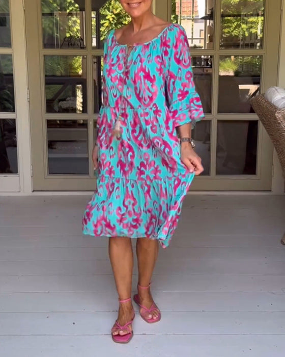Jurk met losse print en klokmouwen