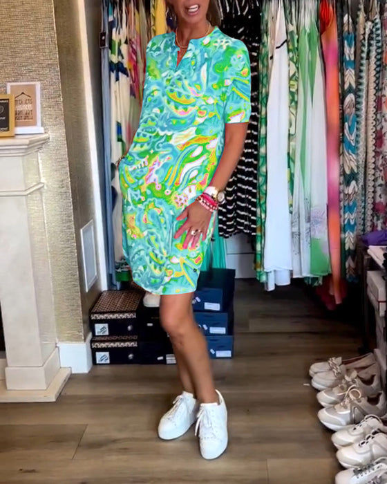 Jurk met zakken en prints en korte mouwen