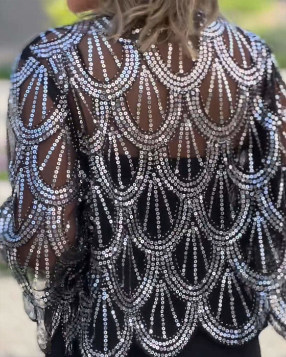 Elegante jas met lovertjes en golvende rand