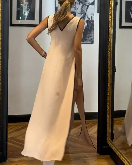 Elegant mouwloos pak in effen kleur met strik