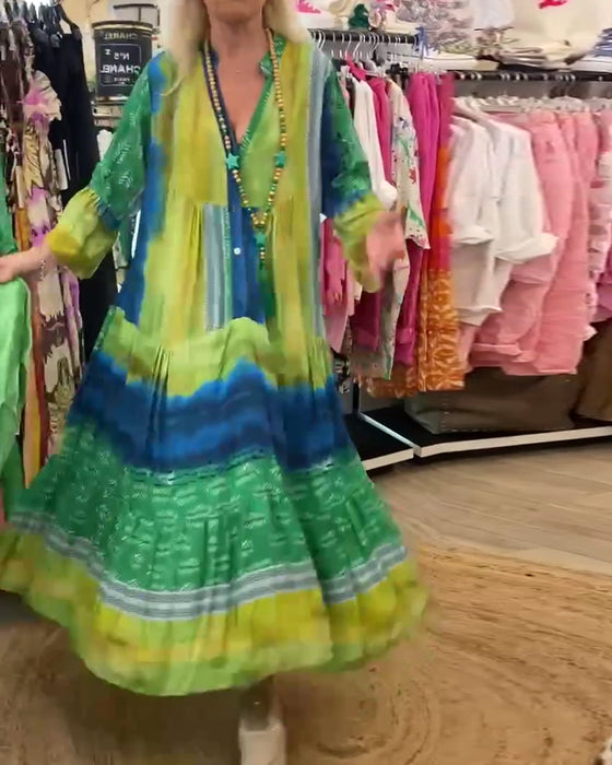 Casual lange jurk met V-hals, uitlopende mouwen en print