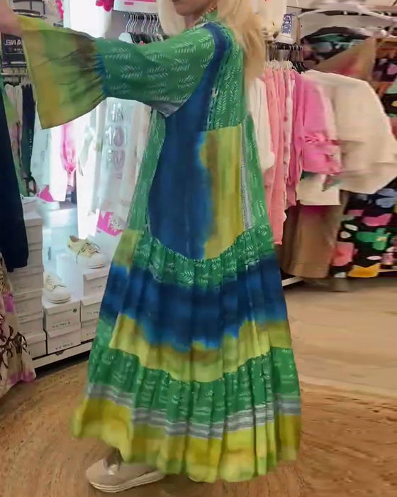 Casual lange jurk met V-hals, uitlopende mouwen en print