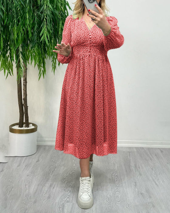 Elegante jurk met knopen en print