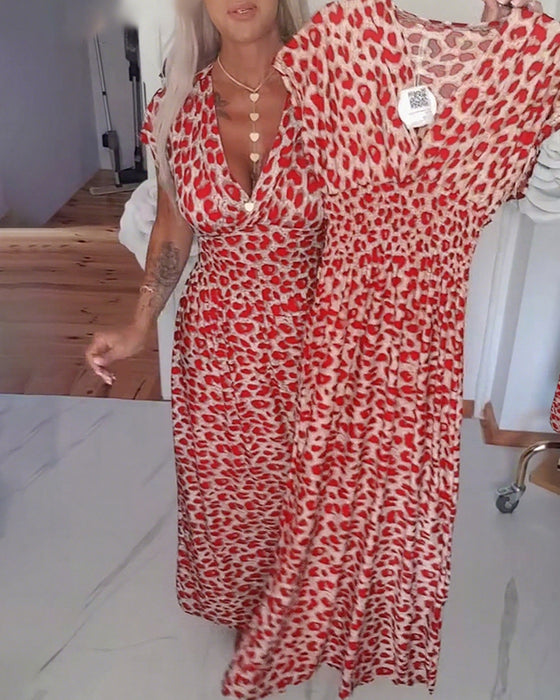 Elegante jurk met luipaardprint en v-hals