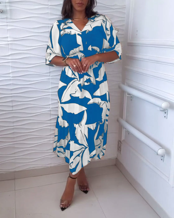 Elegante jurk met V-hals, driekwart mouw en trekkoord