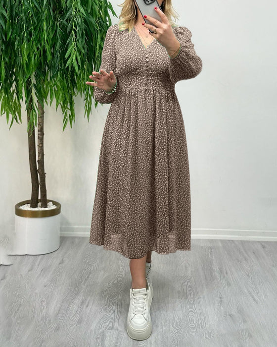 Elegante jurk met knopen en print