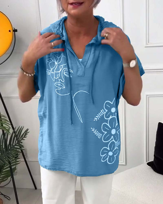 Casual blouse met korte mouwen en bloemenprint met capuchon