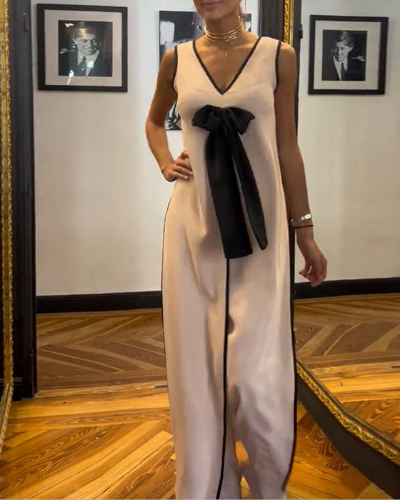 Elegant mouwloos pak in effen kleur met strik