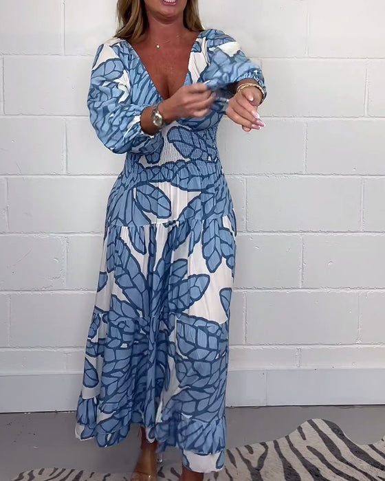 Lange damesjurk met V-hals en print in de taille