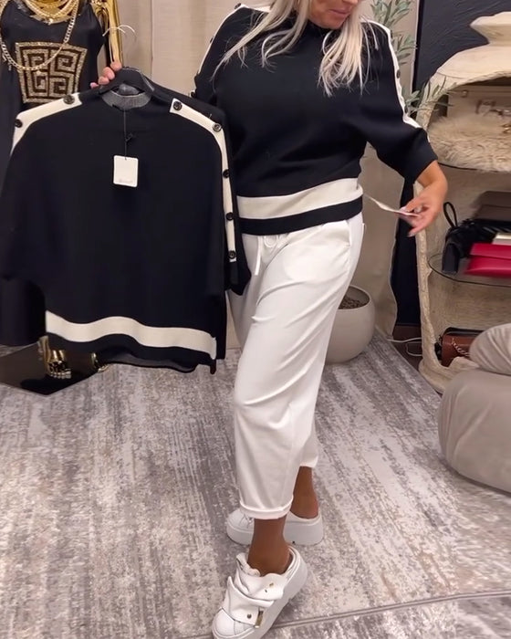 Pullover-trui met kleurblokken en knopen