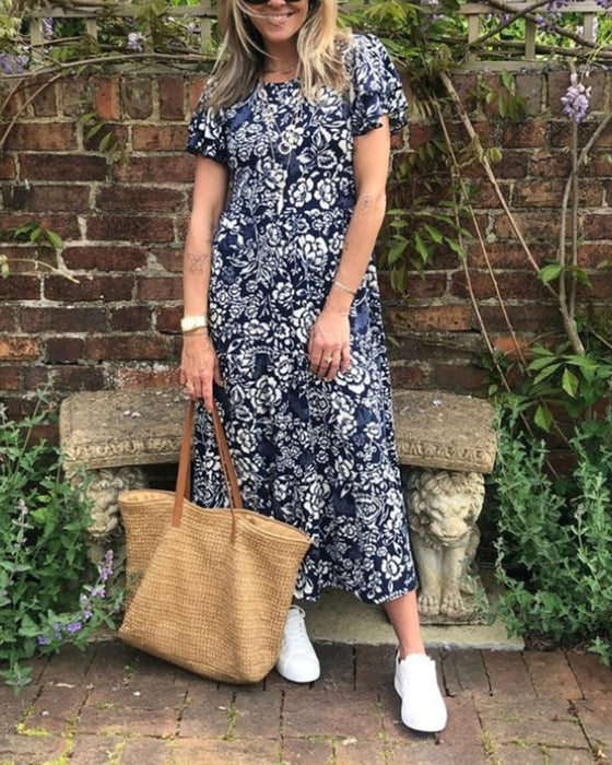 Lange jurk met bloemenprint en korte mouwen