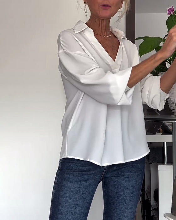 Eenvoudig topje met revers en lange mouwen in effen kleur