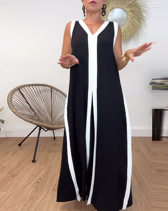 Modieuze mouwloze jurk met V-hals en contrasterende print