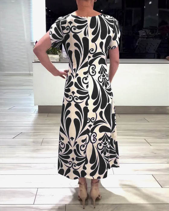 Elegante jurk met korte mouwen en contrastprint