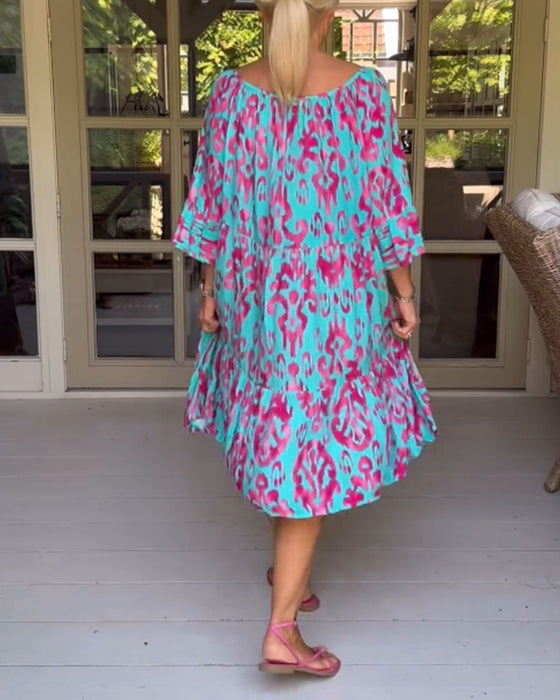 Jurk met losse print en klokmouwen