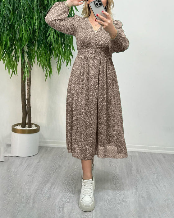 Elegante jurk met knopen en print