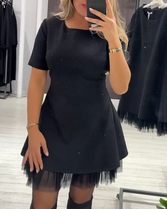 Elegante jurk met glinsterende mesh-patchwork