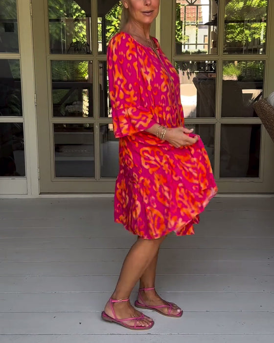 Jurk met losse print en klokmouwen