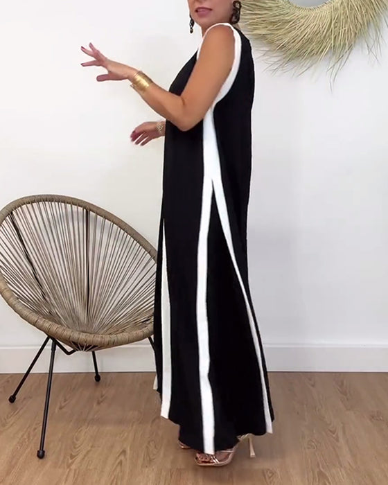 Modieuze mouwloze jurk met V-hals en contrasterende print