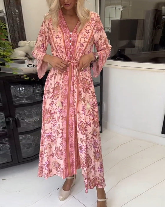 Elegante jurk met V-hals, knoopsluiting en trekkoord met print