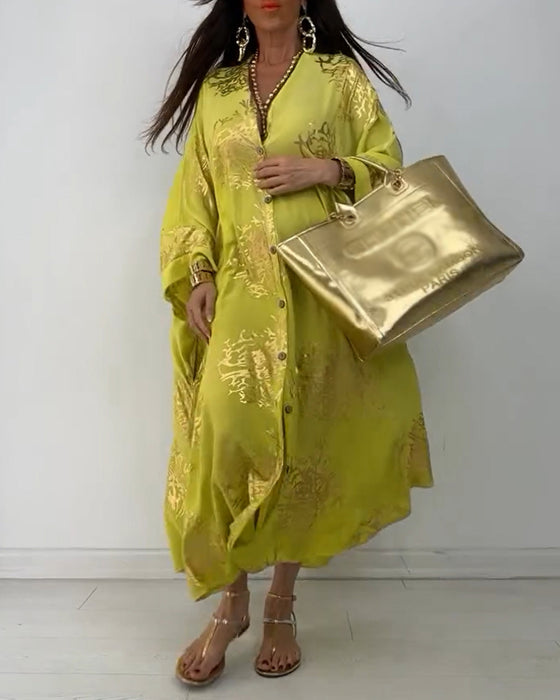 Losse jurk met lange mouwen en knoopsluiting