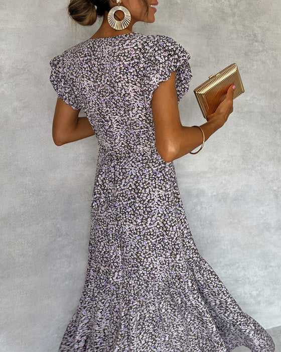 Elegante jurk met ruches aan de mouwen en split