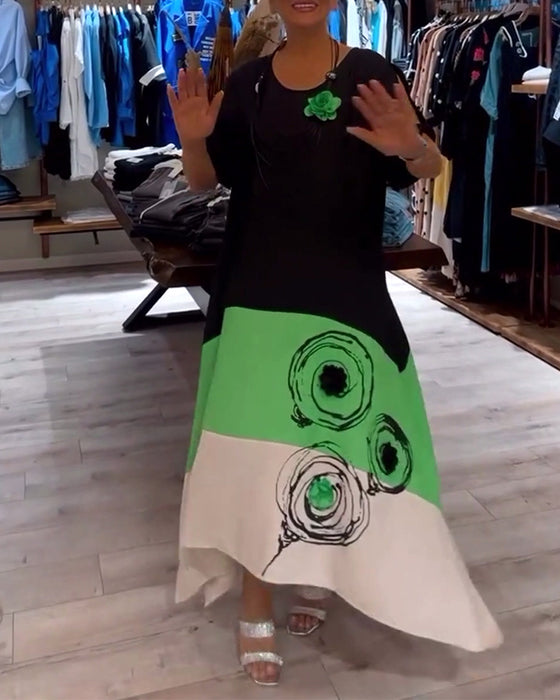 Losse patchworkjurk met ronde hals en kleurenprint