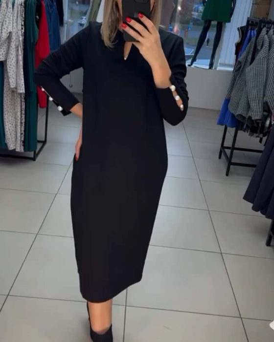 Elegante jurk met parelknopen