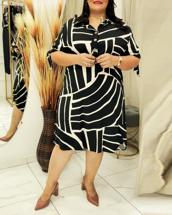 Jurk met reversknopen en lijnprint