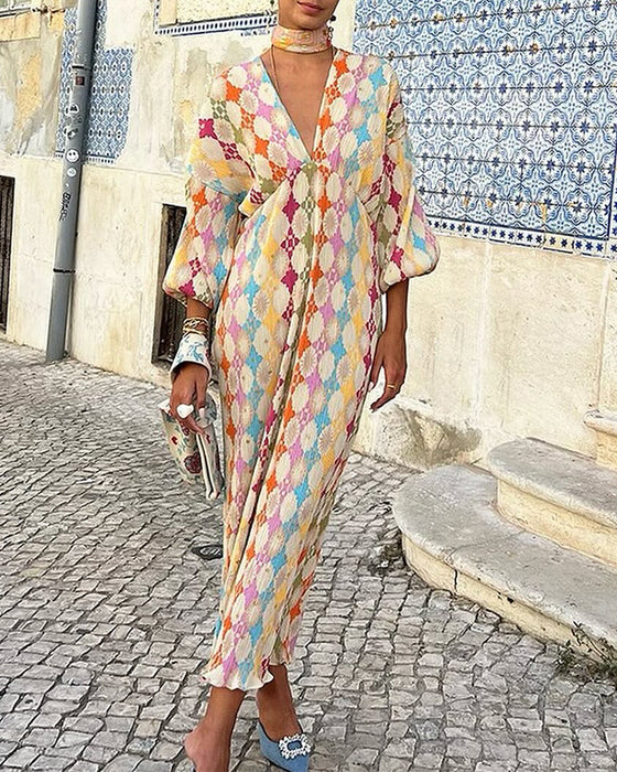 Elegante jurk met V-hals en lantaarnmouwen met geometrische print