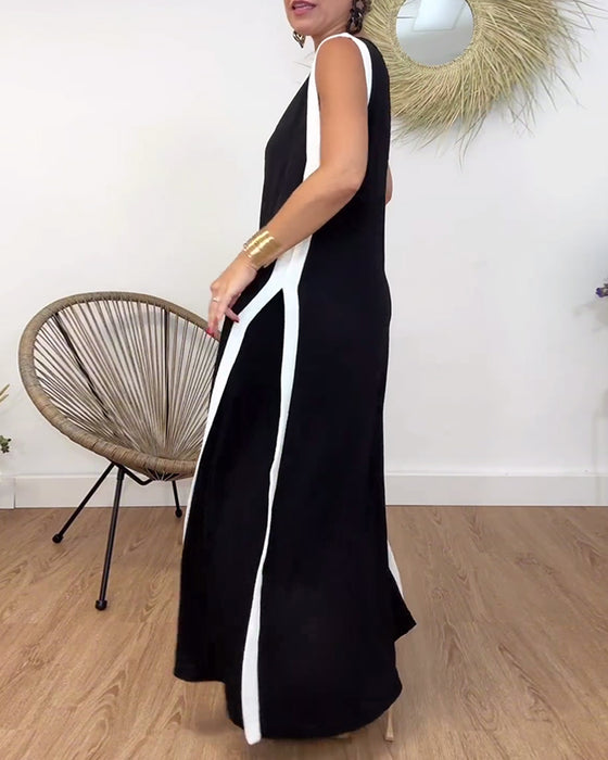 Modieuze mouwloze jurk met V-hals en contrasterende print