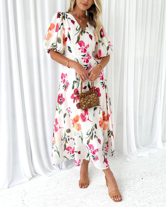 Elegante jurk met pofmouwen en bloemenprint