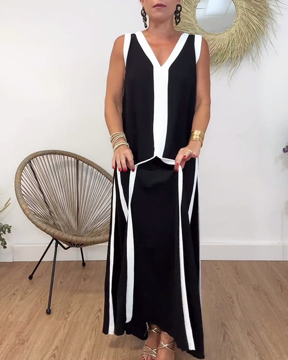 Modieuze mouwloze jurk met V-hals en contrasterende print