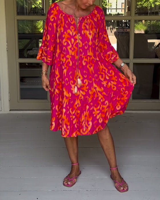 Jurk met losse print en klokmouwen