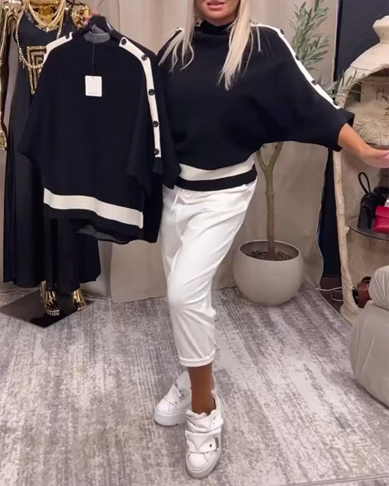 Pullover-trui met kleurblokken en knopen