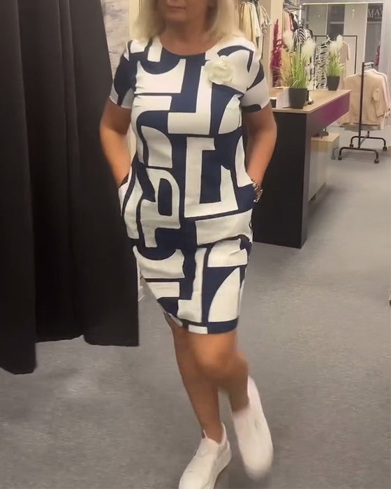 Jurk met ronde hals en zak met geometrische print