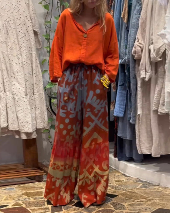 Losse broek met wijde pijpen en zak met print