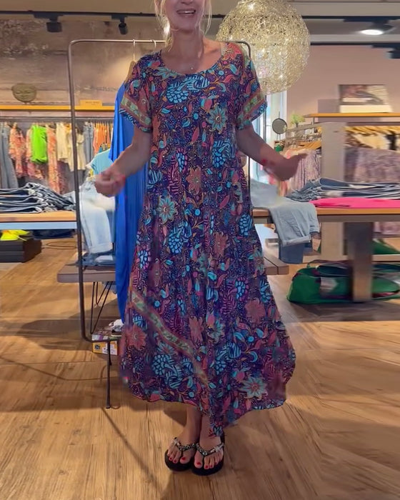 Lange jurk met korte mouwen en ronde hals met print