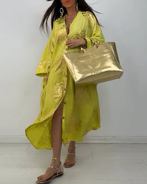 Losse jurk met lange mouwen en knoopsluiting