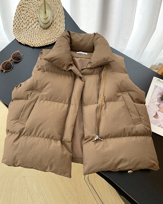 Eenvoudige effenkleurige, gewatteerde jas met ritszak en mouwloos design