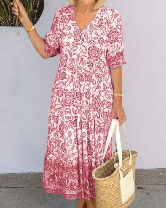 Blauwe jurk met V-hals en bloemenprint