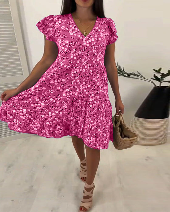 Mouwloze midi-jurk met V-hals en bloemenprint