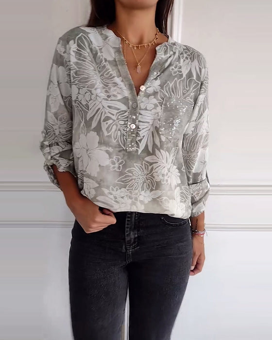 Top met bladprint en patchwork-pailletten